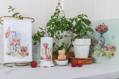 Strawberry soap dispenser at a summer kitchen or bathroom sink.