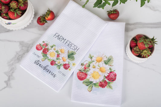 Watercolour strawberry tea towel in a cottage-style summer kitchen.
