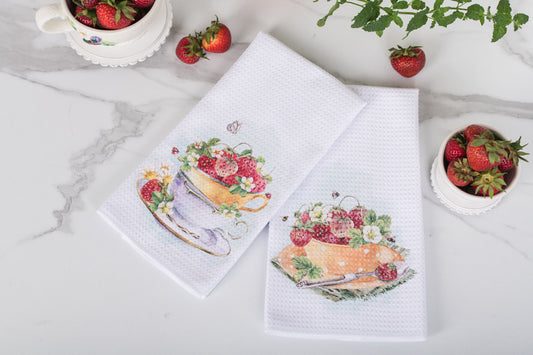 Watercolour strawberry tea towel in a cottage-style summer kitchen.
