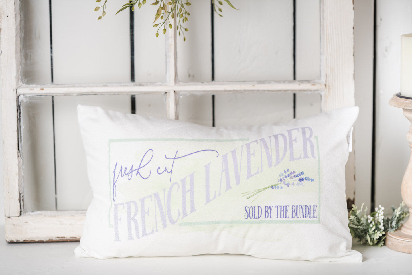Lumbar lavender pillow on a farmhouse bench