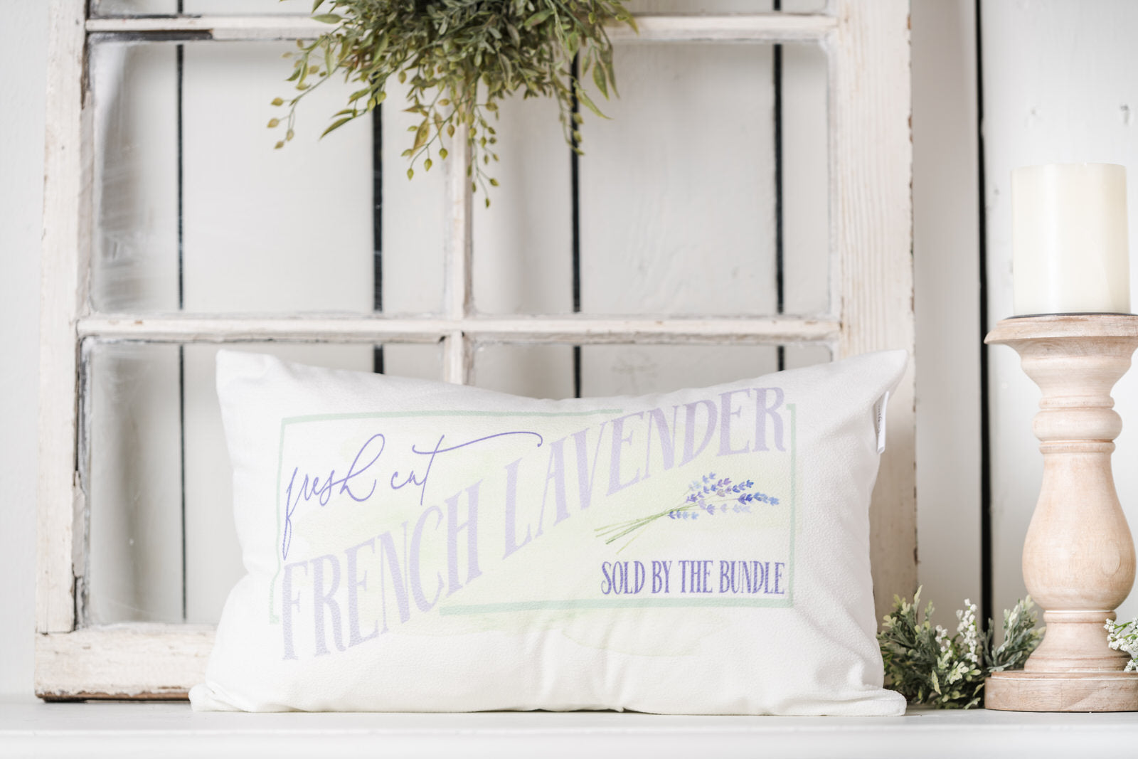 Lumbar lavender pillow on a farmhouse bench