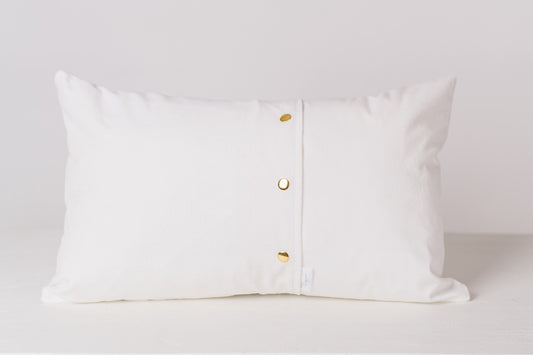 back of a white lumbar pillow